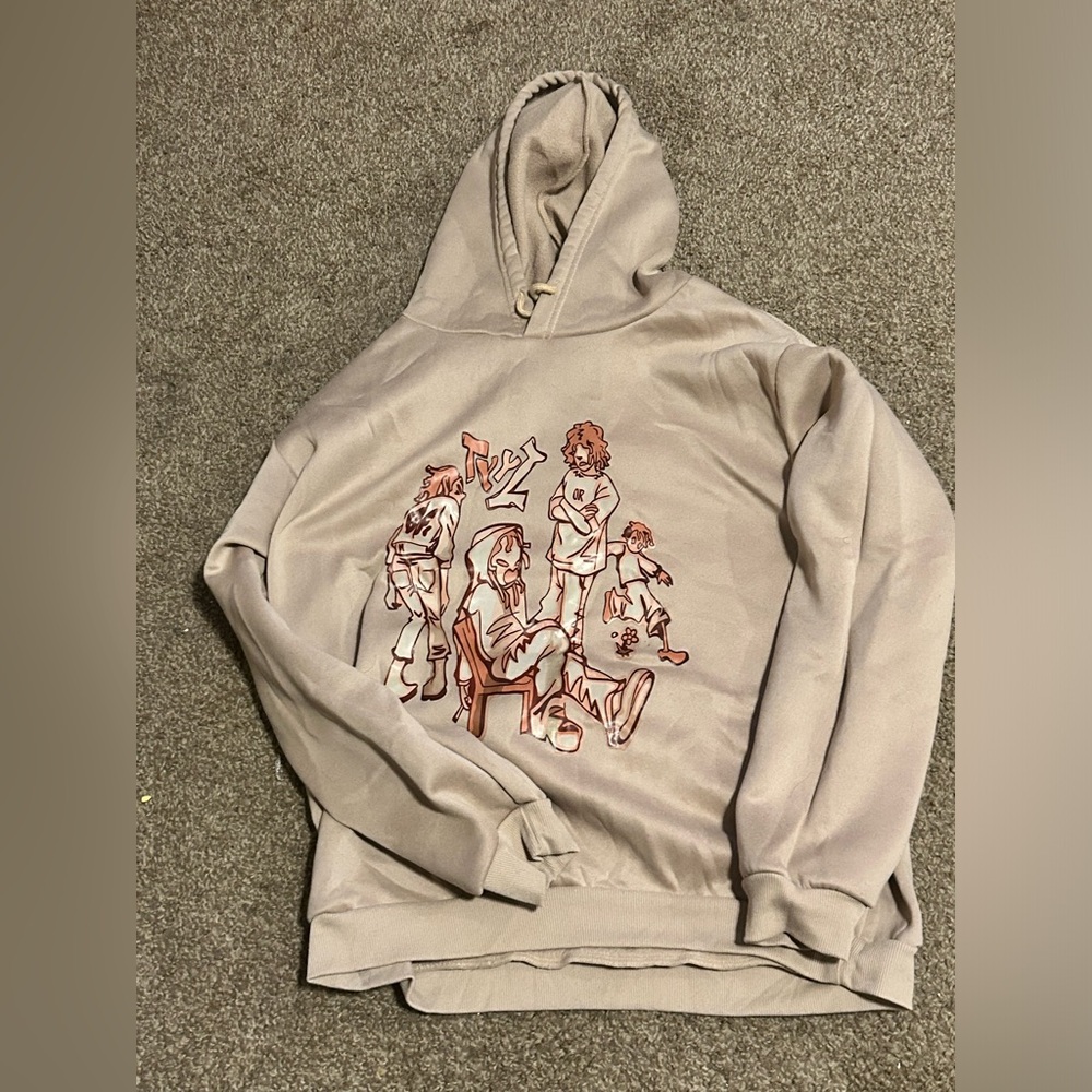 A tan cream hoodie with a cool design